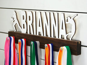 Our personalized volleyball medal holder is a unique gift for any volleyball player so they can display all of their awesome and well-deserved awards. This design comes in a variety of colors, or you can pick from our other choices of sports or phrases so we can customize it just the way you want!