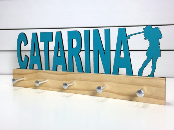  Our personalized golf medal holder is a unique gift for the golfer in your life. This display will be the perfect way for her to show off all of her well-deserved awards. This design comes in a variety of colors, or you can pick from our other choices of sports or phrases so we can customize it just the way you want!