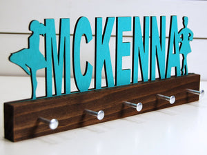 Our personalized Irish dance medal holder is a unique gift for the dancer in your life. This display will be the perfect way for them to show off all of their well-deserved awards. This design comes in a variety of colors, or you can pick from our other choices of sports or phrases so we can customize it just the way you want!