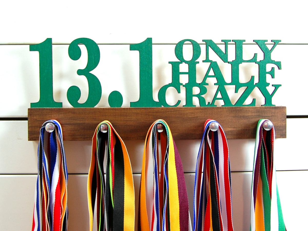 Our half marathon running medal holder is a great gift for any runner so they can display all of their awesome awards. This design comes in a variety of colors, or you can pick from our other choices of sports or phrases. Better yet, tell us your own personal mantra so we can customize a unique medal holder just for you!