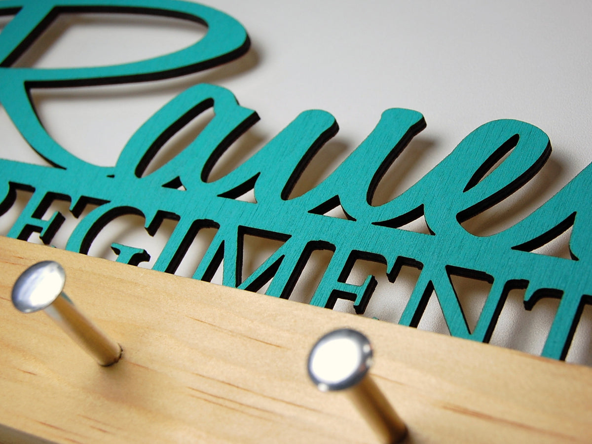 &quot;Rauen&quot; key hook display in turquoise text on a clear base