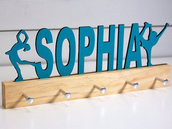  Our personalized figure skater medal holder is a unique gift for the skater in your life. This display will be the perfect way for them to show off all of their well-deserved awards. This design comes in a variety of colors, or you can pick from our other choices of sports or phrases so we can customize it just the way you want!