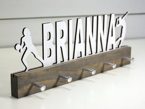  Our personalized volleyball medal holder is a unique gift for any volleyball player so they can display all of their awesome and well-deserved awards. This design comes in a variety of colors, or you can pick from our other choices of sports or phrases so we can customize it just the way you want!