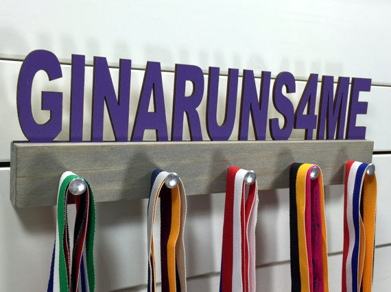 Our Custom Phrase &amp; Font medal holder is the perfect gift for any award-winner. You choose your color, font, and phrase, and we&#39;ll create a unique display just for you!