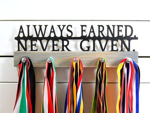 This medal holder is a great gift for any athlete so they can show off all of their awesome awards. This design comes in a variety of colors, or you can pick from our other choices of sports or phrases. Better yet, tell us your own personal mantra so we can customize a unique medal holder just for you!